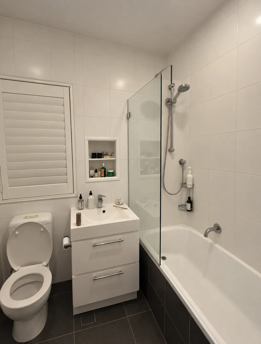 Before bathroom with a recreated angle based on the original photograph
