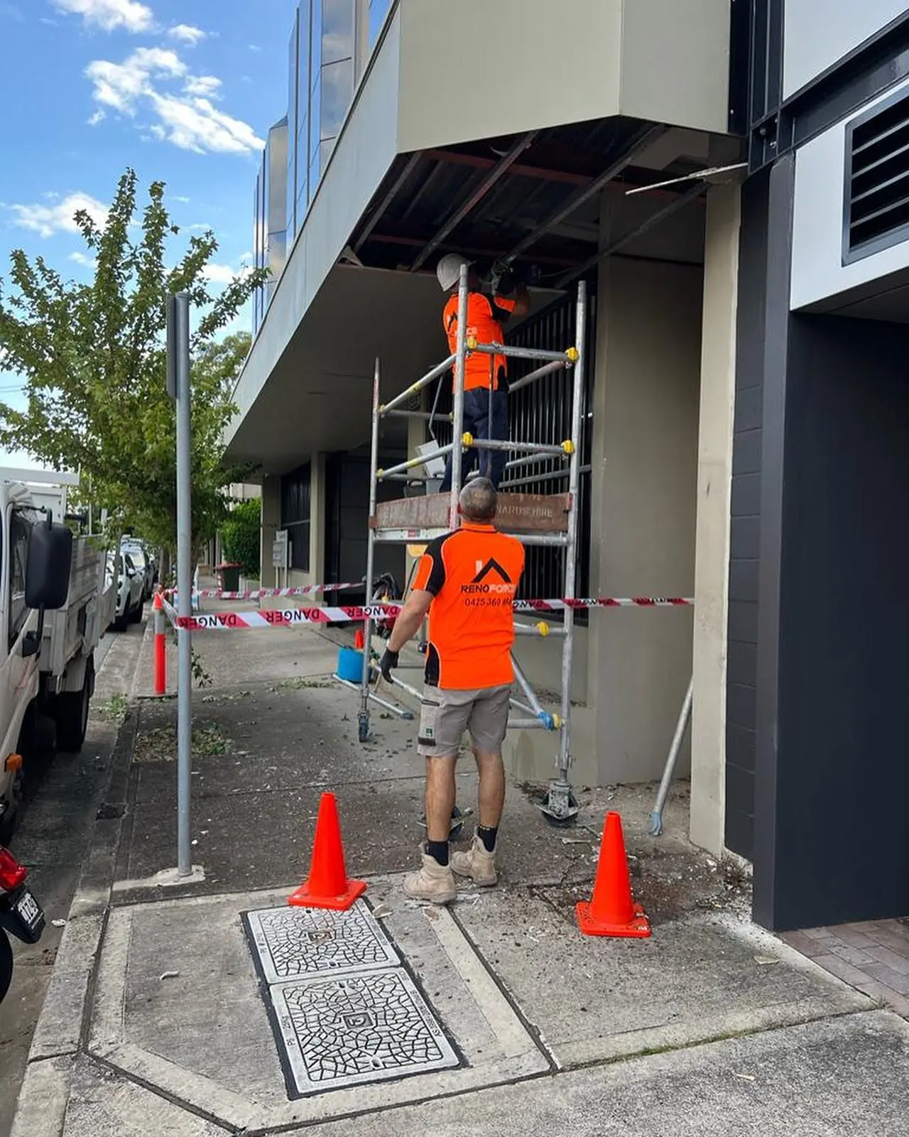 Renoforce team working on a commercial building exterior