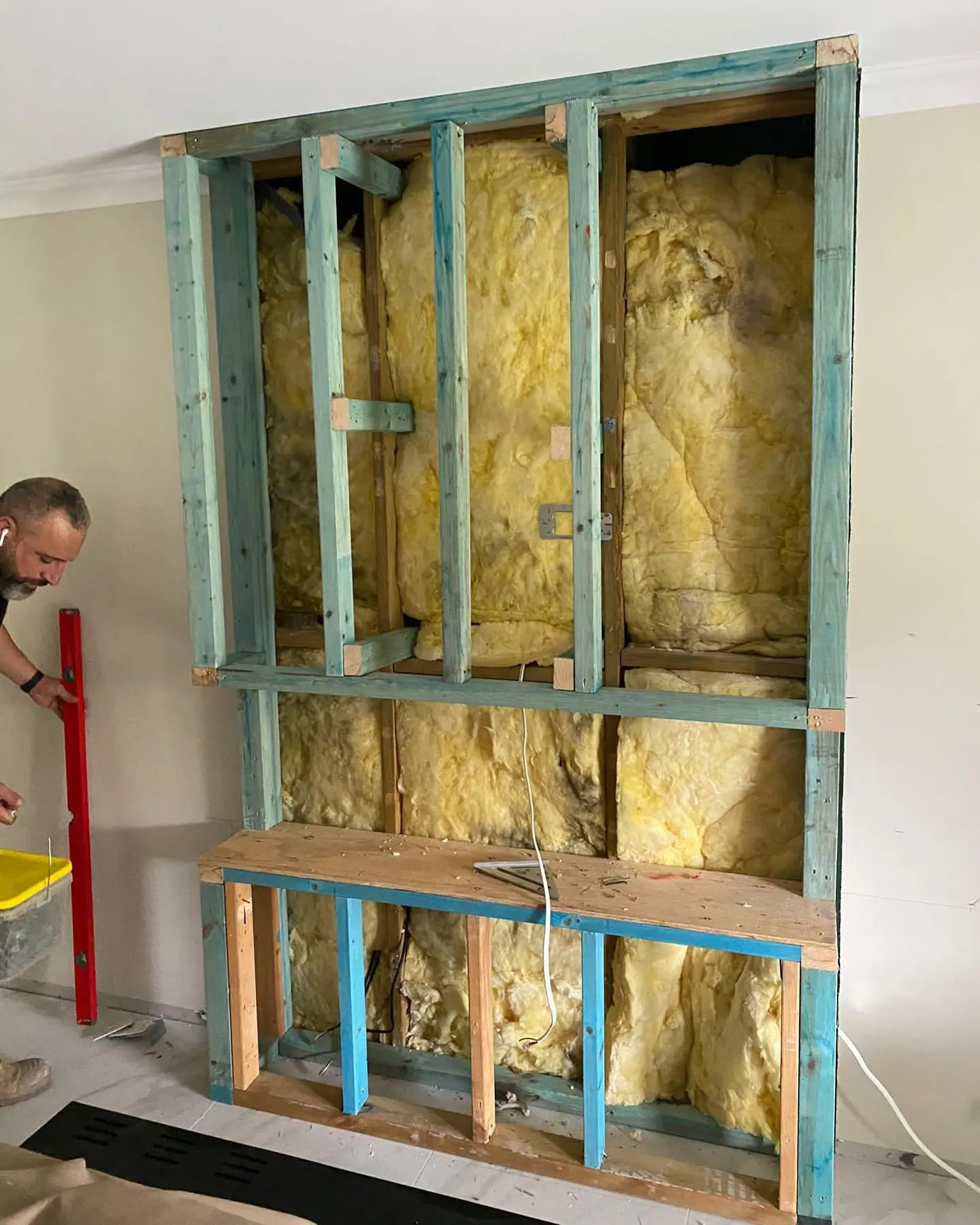 Wall framing and insulation during fireplace installation