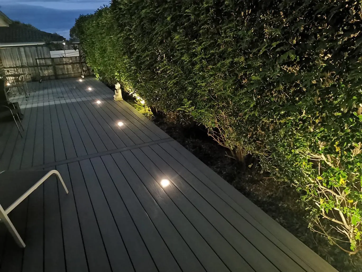 Finished garden deck with recessed lighting at night