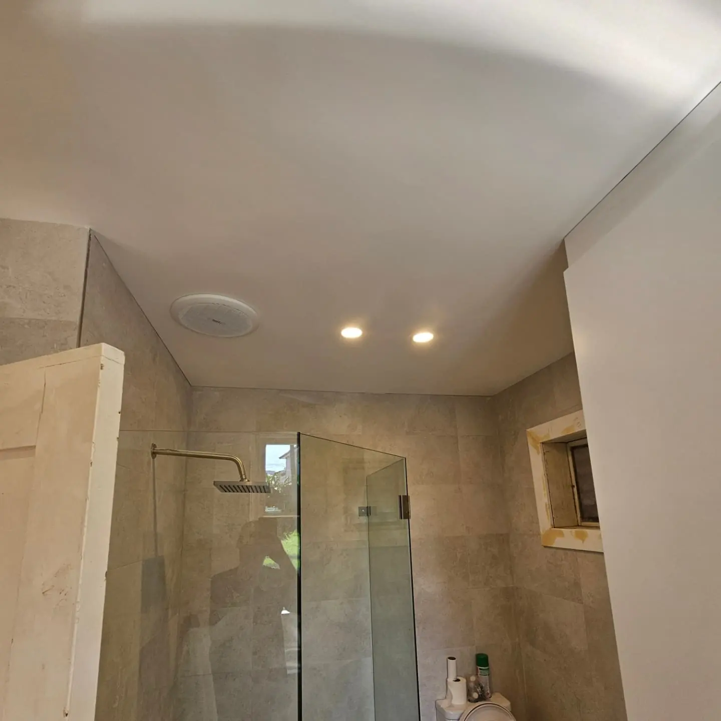 Bathroom renovation with stone finishes and a bath